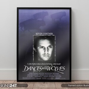May include: Framed movie poster for "Dances with Wolves" starring Kevin Costner. The poster is in a black frame with a dark blue and black background. The title and actor's name are displayed. The image includes the text "Signs247".