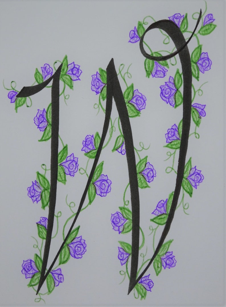 May include: A black calligraphy letter W with a vine of purple flowers and green leaves.