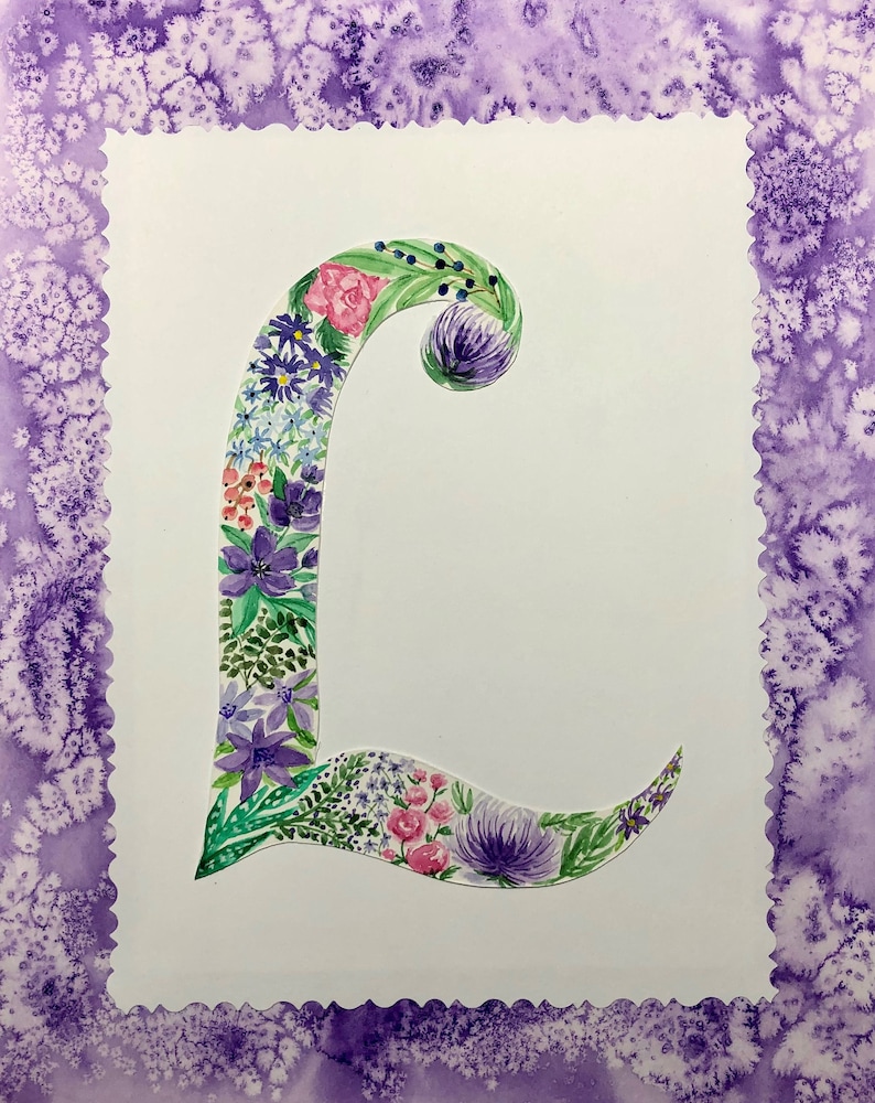 May include: A watercolor painting of the letter L, decorated with purple, pink, and green flowers. The letter is surrounded by a purple border.