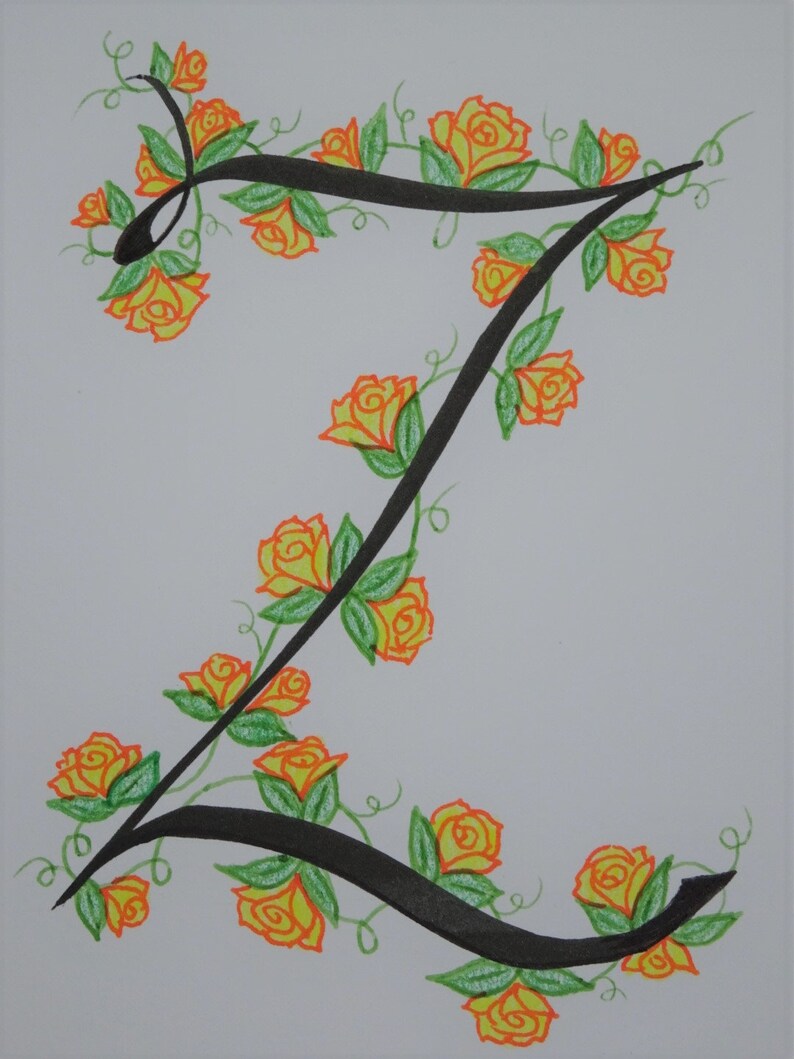 May include: A black calligraphic letter Z with a vine of yellow roses and green leaves winding around it.