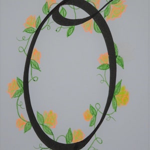 May include: A black calligraphic letter O surrounded by a vine with orange flowers and green leaves.