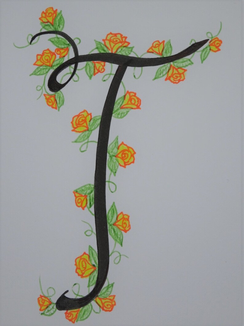 May include: A black calligraphic letter T with a vine of orange roses and green leaves winding around it.