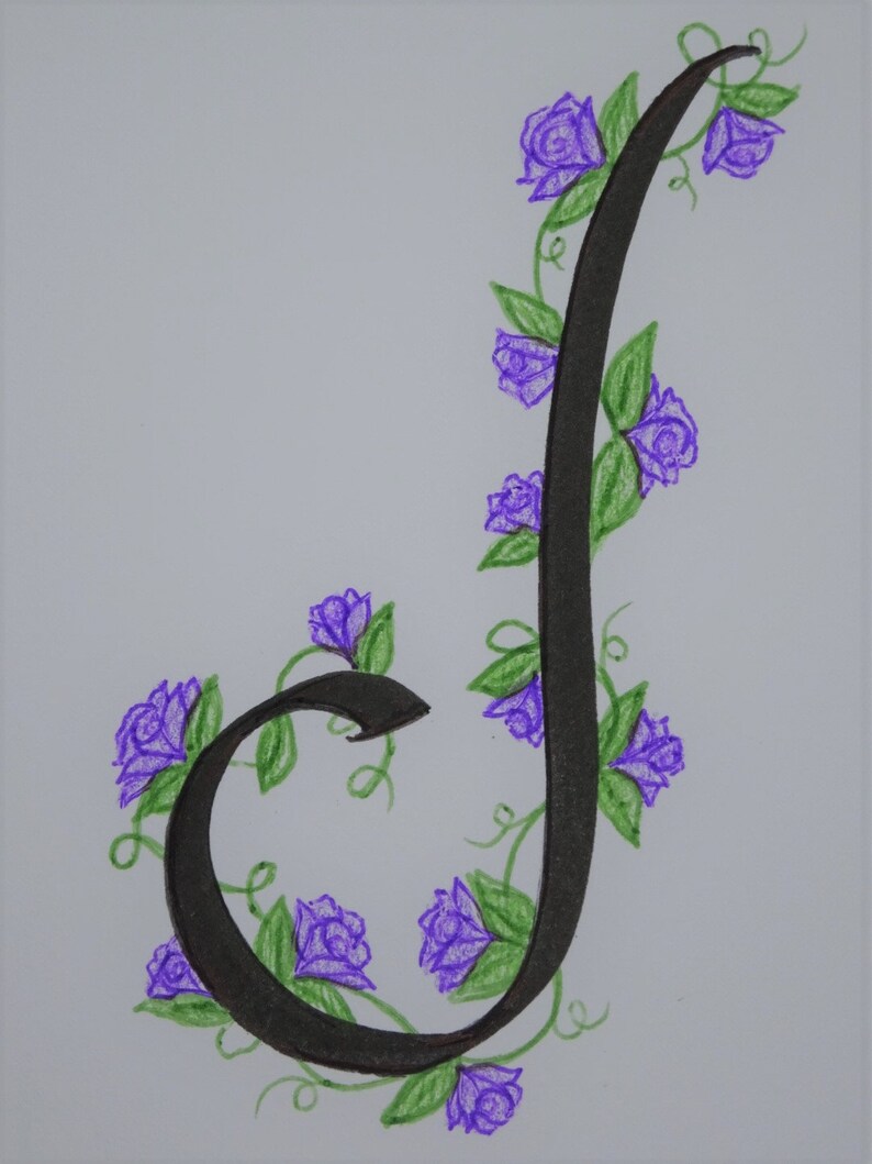 May include: A black calligraphic letter J with a vine of purple flowers and green leaves winding around it.