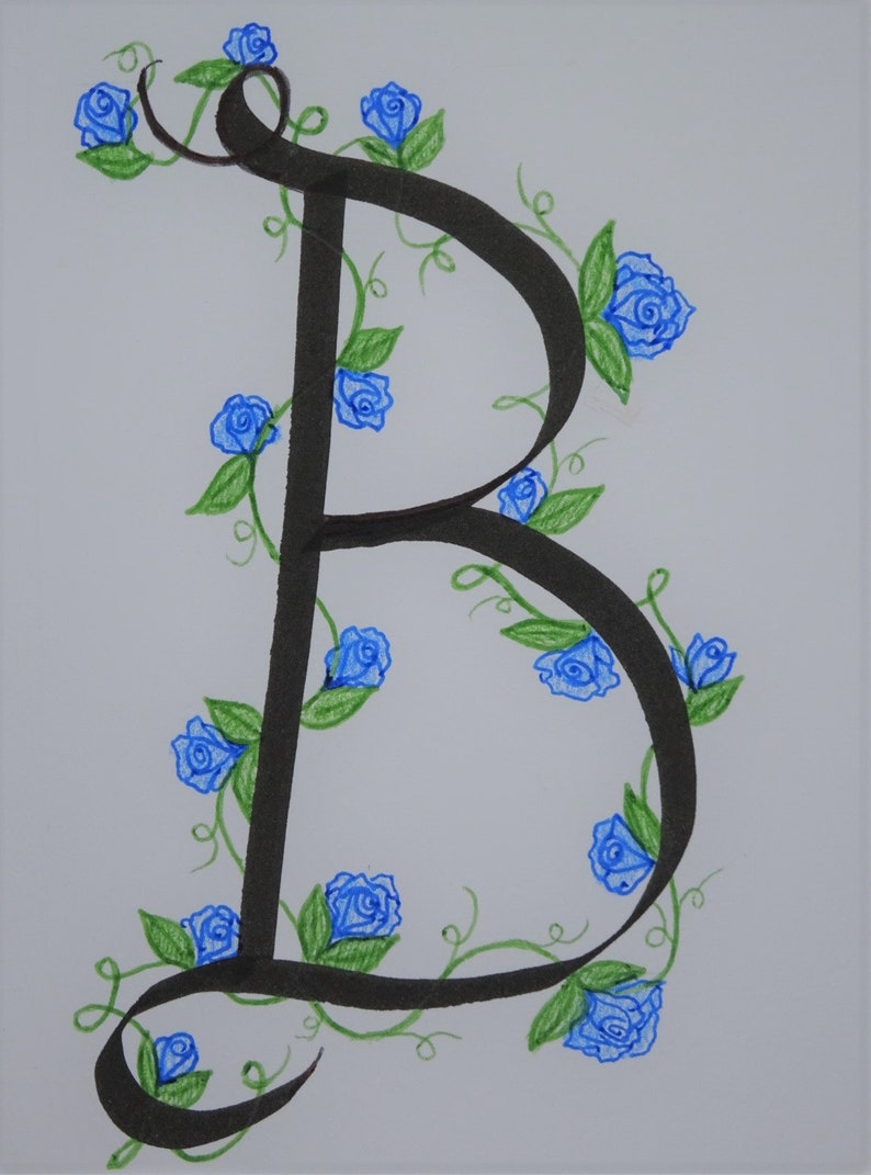 May include: A black calligraphic letter B with a vine of blue roses and green leaves winding around it.