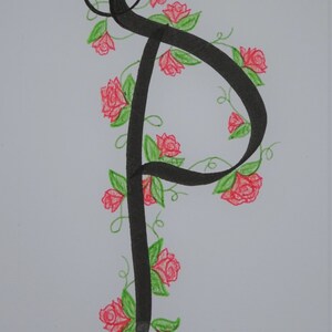 May include: A black calligraphic letter "P" with a vine of green leaves and pink roses winding around it.