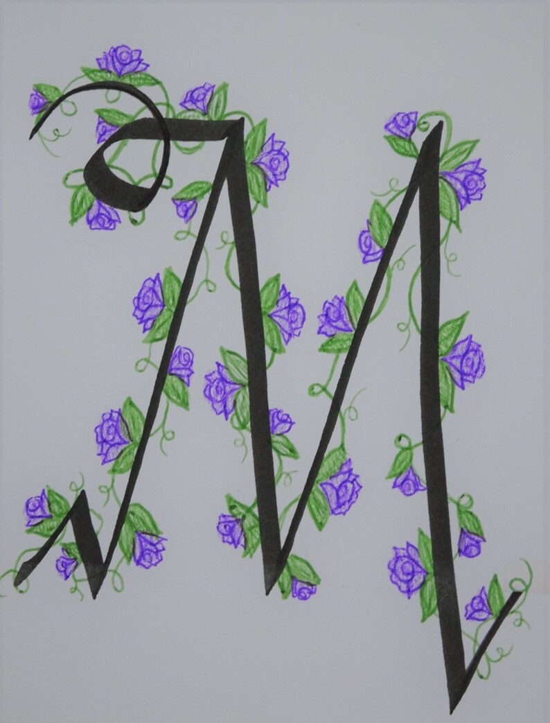 May include: A hand-drawn letter M with a black ink outline. The letter is decorated with purple flowers and green vines.