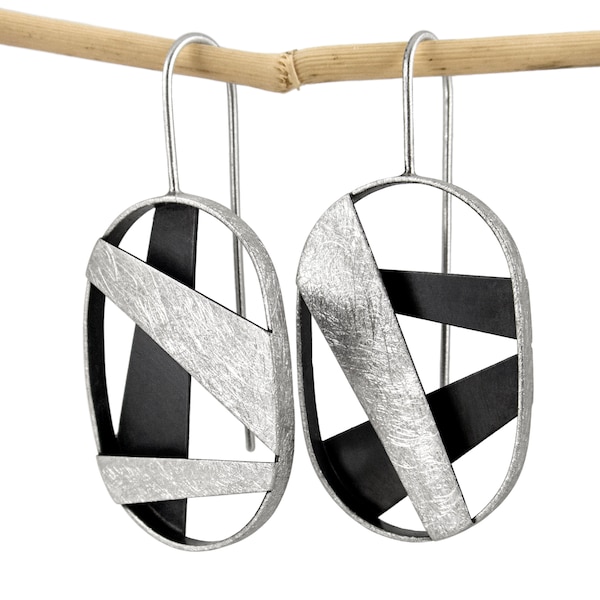Geometric silver dangle earrings. Oval drop earrings. Asymmetric silver dangle earrings. Contemporary silver earrings. Sculptural earrings