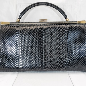Bolso de mano vintage con forma de serpiente en color negro, original de los años 40