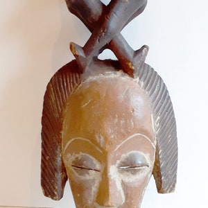 Punu mask with embracing figures