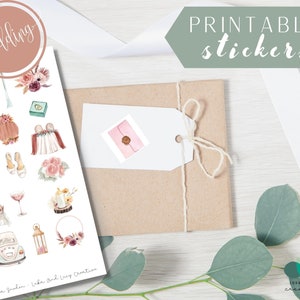 May include: Printable wedding stickers featuring illustrations of a wedding arch, a bouquet, a ring box, a wedding dress, a pair of shoes, a lantern, a car, a wreath, a champagne flute, a cake, and a couple. The stickers are on a white background with the text "wedding" in a circle at the top and "Printable stickers" in a green rectangle at the top right.