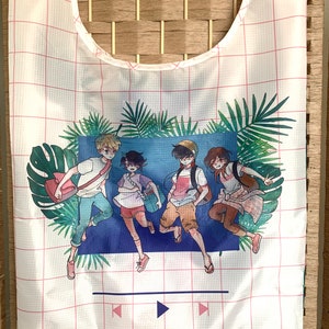 May include: White reusable tote bag with a pink grid pattern. The bag features a colorful illustration of four cartoon characters running through a tropical scene with palm trees and a blue background. The text "PLAY" is printed in white at the bottom of the bag.