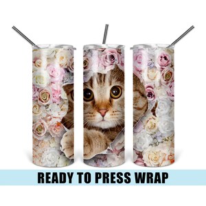 May include: A sublimation design featuring a cat peeking out of a floral arrangement. The design is ready to be pressed onto a tumbler.