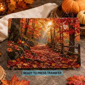 May include: A rectangular sublimation transfer sheet featuring a vibrant autumn forest scene with a sunlit path covered in red and orange fallen leaves, a wooden fence, and a small lantern, with the text READY TO PRESS TRANSFER at the bottom.