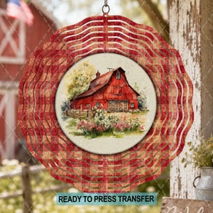 May include: A circular metal wind spinner featuring a red and white gingham pattern on the outer scalloped edges. The center displays a circular illustration of a red barn with a metal roof, surrounded by green trees and pink flowers.
