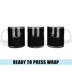 May include: Three black mugs with a silver deer antler design. The mugs are ready to be pressed with a heat press.