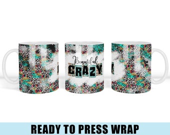 May include: A white ceramic mug with a turquoise, black, and white animal print design. The mug has the text "Beautiful Crazy" printed on the front.