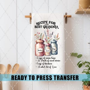 May include: White kitchen towel with the text "RECIPE FOR THE BEST GRANDMA" and illustrations of jars labeled "Kindness", "Love", and "Hugs". The towel also lists ingredients for a recipe. The words "READY TO PRESS TRANSFER" are at the bottom.