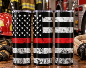 May include: Three cylindrical tumblers with metal straws, each featuring a distressed American flag design with a horizontal red stripe across the center. The pattern includes white stars on a black field and alternating black and white stripes.