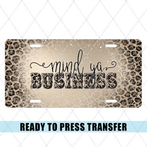 May include: A ready to press transfer with a leopard print background and the text "mind ya BUSINESS" in black lettering.