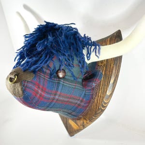 Handmade Highland cow trophy head, made in tartan and tweeds. Fabric cow&#39;s head, to hang on your wall, the perfect Scottish gift.