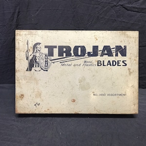 Trojan metal fourteen compartment saw blade caddy.
