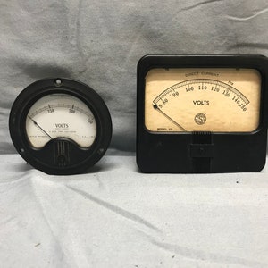 Pair of vintage panel meters, electrical gauges.