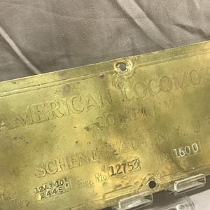 May include: A brass plaque with the text "AMERICAN LOCOMO COMPANY SCHENECTADY, NY, U.S. HR 1600" and the numbers "1244E" and "12753".