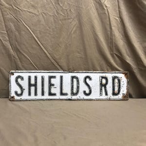 Vintage heavy pressed metal Shields Rd. Road sign. Vintage street sign.