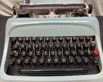 Vintage mid century Olivetti Studio 44 manual typewriter manufactured by Olivetti in Italy.