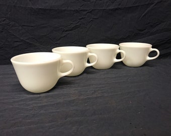 Lot of four vintage Pyrex coffee or tea cups.