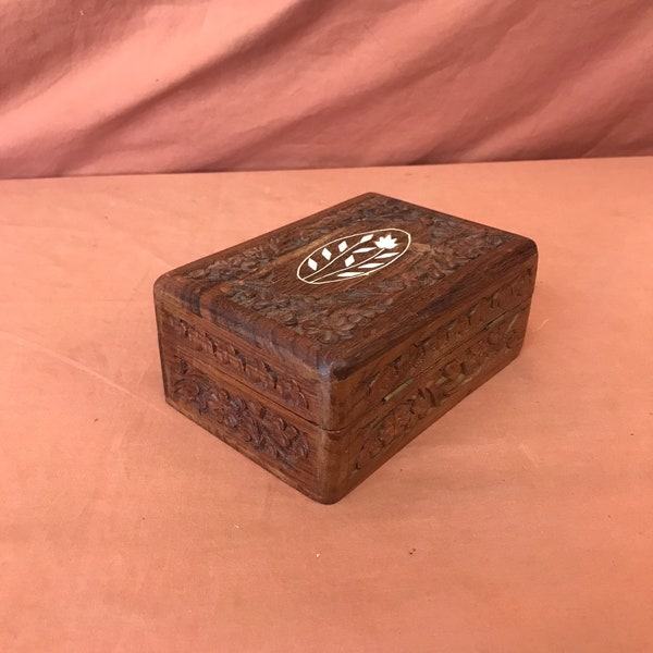 Vintage wood carved trinket or jewelry box.