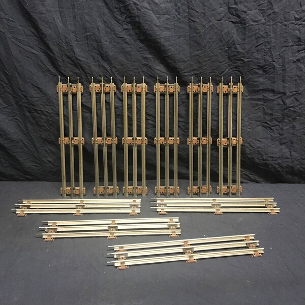 Ten piece lot of O27 gauge nine inch straight track. Lionel straight track.