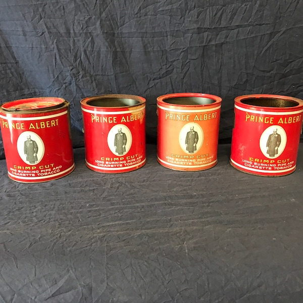 Lot of four vintage Prince Albert tobacco cans.