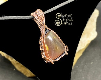Amber trianglish tumble, shaman styled in oxidized copper