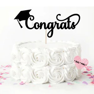 May include: A white cake with white frosting and a black graduation cap and the word "Congrats" on top.