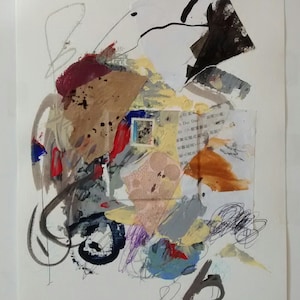 May include: Abstract art collage with a mix of textures and colors, including brown, yellow, red, blue, and black. The collage features a variety of materials, including paper, fabric, and paint. The piece is framed in a white mat and has a white background.