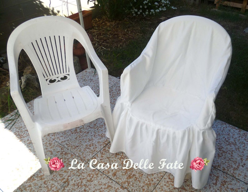 May include: Two white plastic chairs, one with a white fabric cover with a ruffled edge. The chairs are on a tiled floor.