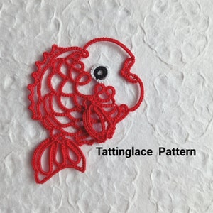 May include: Red tatting lace pattern of a fish with a white eye. The text "Tattinglace Pattern" is below the fish.