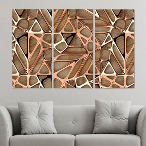 May include: A three-piece abstract wall art set featuring a geometric pattern of overlapping triangles in shades of brown and gold.