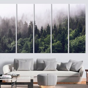 May include: A panoramic view of a lush green forest with tall trees and a thick layer of fog. The fog creates a mysterious and ethereal atmosphere, adding depth and dimension to the scene.