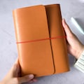 A5 Trifold Leather Traveler’s Notebook Cover | 6 Colors | Elastic Band Closure | Fits A5 Refills product logo