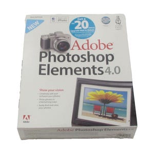 May include: Adobe Photoshop Elements 4.0 software box. The box is white with the Adobe logo and product name in large black letters. A picture of a camera and a framed beach scene are also on the box. The box also has the text "Show your vision".