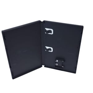 May include: An open, black plastic video game case. The case is rectangular with a hinged design, revealing the interior with white clips for securing game cartridges. The case is designed to hold a game cartridge.