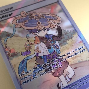 May include: A colorful anime-style illustration of a character with blue hair and a large, ornate hat. The character is holding a blue and white umbrella. The text "Kyougen: Compress the atmosphere into a singular vacuum that grinds all troubles away. When this card is played, your attack hits 3 times." is printed below the character.