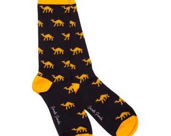 May include: A pair of black socks with a yellow camel pattern. The socks have a yellow cuff and the brand name "Swanky Panda" is printed on the side.