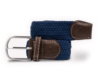May include: A navy blue braided belt with a brown leather buckle and a small logo on the buckle. The belt is made of a woven fabric and has a silver buckle.