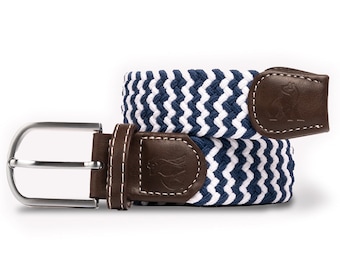 May include: A blue and white striped woven belt with a brown leather buckle and a silver metal buckle. The buckle has a small logo on it.
