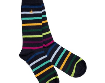 May include: A pair of navy blue socks with horizontal stripes in various colors, including yellow, green, pink, and blue. The socks have a small embroidered emblem near the top. The socks are made of a soft, comfortable material.
