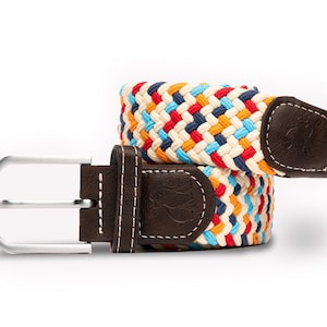 May include: A colourful braided belt with a brown leather buckle and a silver buckle. The belt is made of a woven fabric with red, orange, yellow, blue, and white stripes.