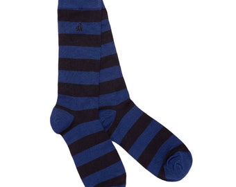May include: A pair of blue and black striped socks. The socks have a small embroidered logo on the top.